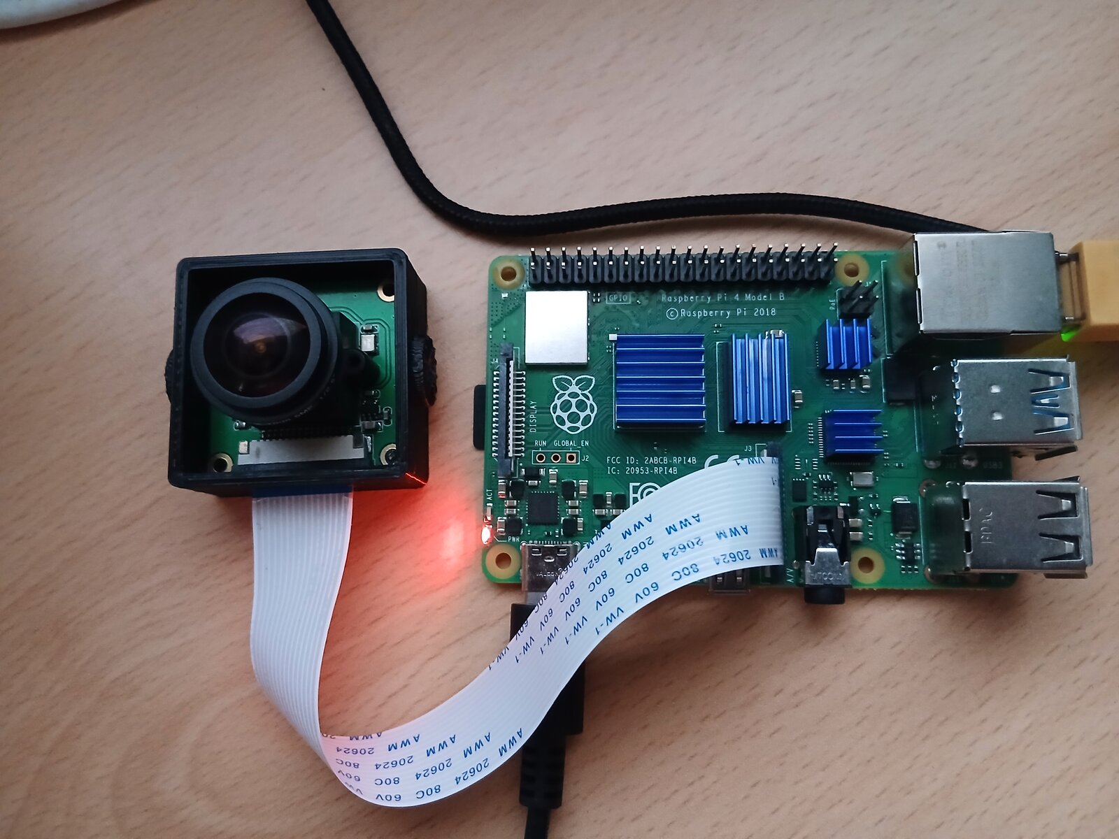 Raspberry Pi 4 with OV5647 camera module connected via ribbon cable